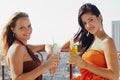 Two girls on holidays in Cuba, holding cocktails Royalty Free Stock Photo