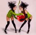 Two girls with huge cherry