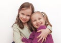 Two girls hugging each other and smiling Royalty Free Stock Photo