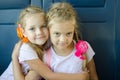 Two girls hugging look in frame, sitting in an electric train, close-up Royalty Free Stock Photo