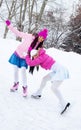 Two girls ice skating Royalty Free Stock Photo