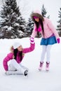 Two girls ice skating Royalty Free Stock Photo