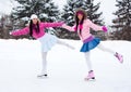 Two girls ice skating