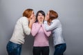 Two girls in jeans European appearance whisper