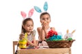 Two girls in kindergarten paint Easter eggs Royalty Free Stock Photo