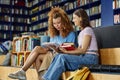 Two Girls in Library Royalty Free Stock Photo