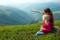 Two girls looking at the mountains