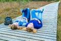 Two girls lying on their backs in nature