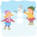 Two girls make a snowman