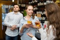 Two girls with man at bar Royalty Free Stock Photo