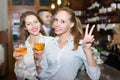 Two girls with man at bar Royalty Free Stock Photo