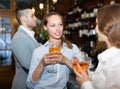 Two girls with man at bar Royalty Free Stock Photo