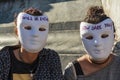 Two girls with masks on climate change protest march