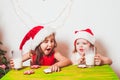 Two girls near Christmas tree Royalty Free Stock Photo