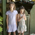 Two girls near fence