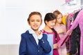 Two girls and one boy with shopping bag in store Royalty Free Stock Photo