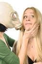 Two girls - one in gas mask Royalty Free Stock Photo