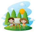 Two girls painting on canvas in garden Royalty Free Stock Photo