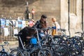 Two girls park their bikes in a parking near college. Cambridge, UK, August 1, 2019 Royalty Free Stock Photo