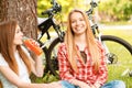 Two girls on a picnic with bikes Royalty Free Stock Photo