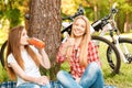 Two girls on a picnic with bikes Royalty Free Stock Photo