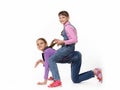 Two girls play horse on a white background Royalty Free Stock Photo