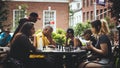 Two girls playing chess at a park