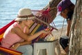 Two girls playing chess by the sea. Royalty Free Stock Photo