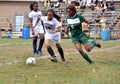 Two girls playing a girls` high school soccer game Royalty Free Stock Photo