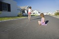 Two Girls Playing Hopscotch On Street Royalty Free Stock Photo