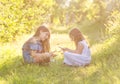 Two girls playing rock paper scissors game outdoors Royalty Free Stock Photo