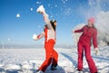 Two girls playing with snow Royalty Free Stock Photo