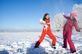 Two girls playing with snow Royalty Free Stock Photo