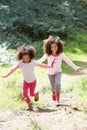 Two Girls Playing In Woods Together Royalty Free Stock Photo