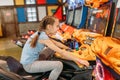 Two girls plays game machine, entertainment center Royalty Free Stock Photo