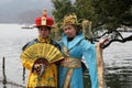 Girls posing in traditional Chinese costumes on the shores of West Lake in Hangzhou, China