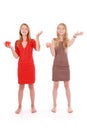 Two girls pretend that juggle fruit