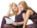 Two girls reading magazine Royalty Free Stock Photo