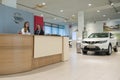 Two girls on a reception in a motor show of the official dealer of the Nissan company