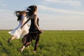 Two girls running on the field 3 Royalty Free Stock Photo
