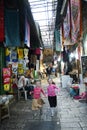 Two girls running in old arabic bazaar in Jerusalem