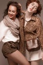 Two girls in safari style sensually posing in the studio Royalty Free Stock Photo