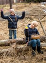 Two girls searching for Easter eggs in forest Royalty Free Stock Photo