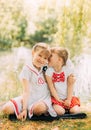 Two girls sisters hug and having fun in the summer in nature. Concept of happy childhood and summer leisure. Kids play outdoor. Royalty Free Stock Photo