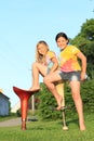 Two girls sitting on bar chairs Royalty Free Stock Photo