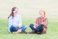 Two Girls Sitting on Grass Royalty Free Stock Photo