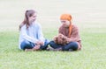 Two Girls Sitting on Grass Royalty Free Stock Photo