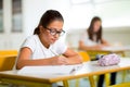 Two girls sitting in a school classroom Royalty Free Stock Photo