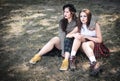 Two girls spend time together outdoors. The concept of difficult teenagers, bad students