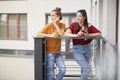 Two girls spending time relaxing on balcony